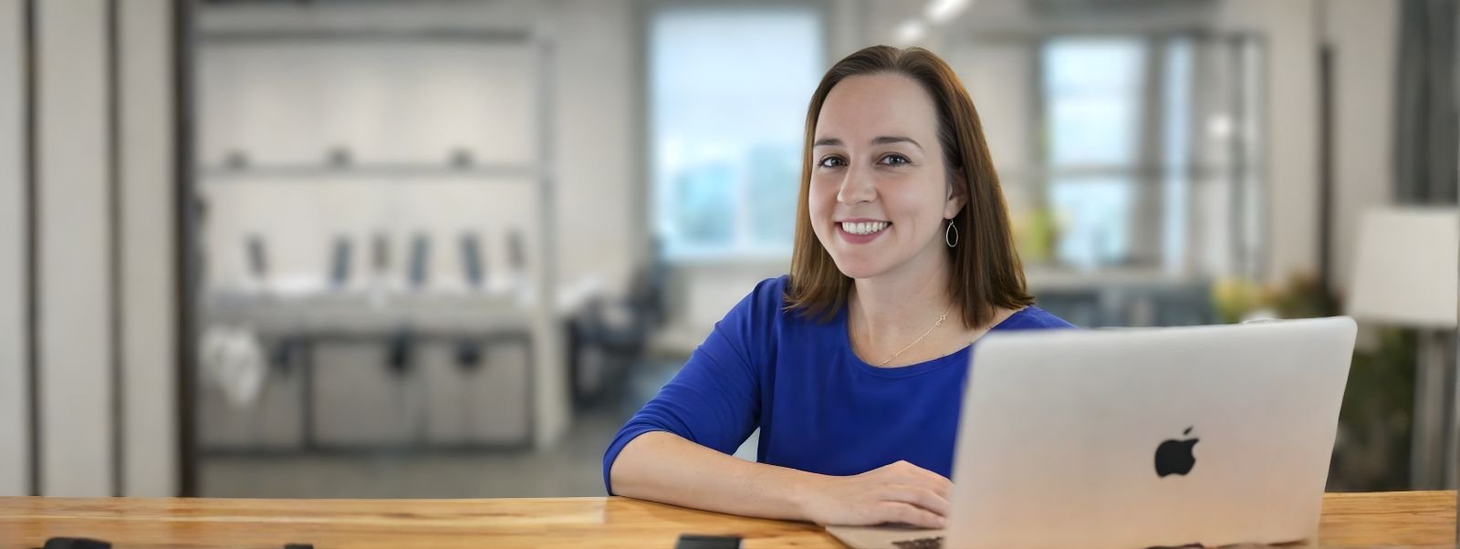 kathleen working on website with laptop