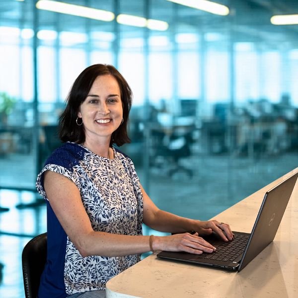 kathy working at desk smiling